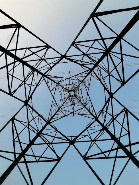 Cryptography Mirror wallpaper pattern — base photo: Dramatic view looking up inside a steel transmission tower against a blue sky.