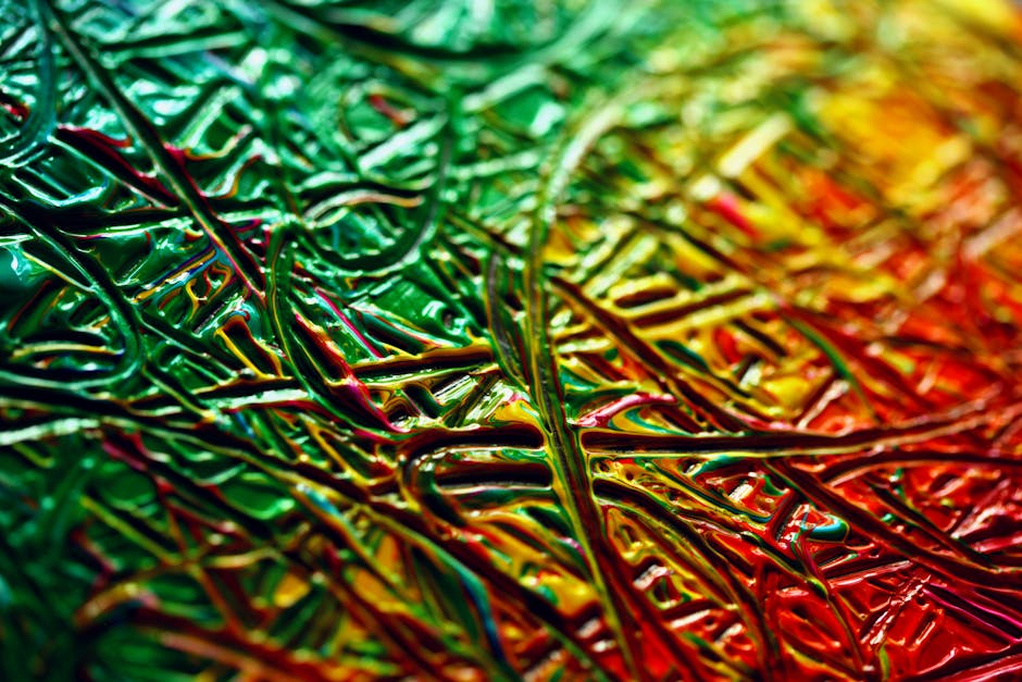 Abstract Rotation wallpaper pattern — base photo: A close-up shot of a vibrant abstract texture with green, red, and yellow swirling patterns.