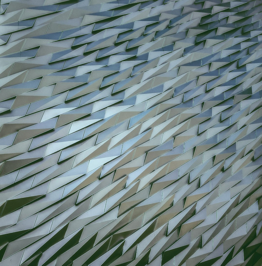 Seamless kaleidoscope wallpaper pattern — Origami by wallpaper⁶ — base photo: Facade of the Titanic Museum.