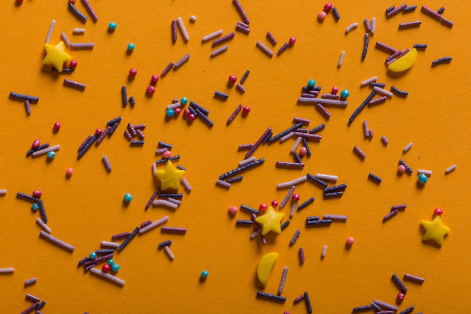 Seamless mirror wallpaper pattern — Cartography by wallpaper⁶ — base photo: A vibrant array of colorful sprinkles scattered on an orange surface.