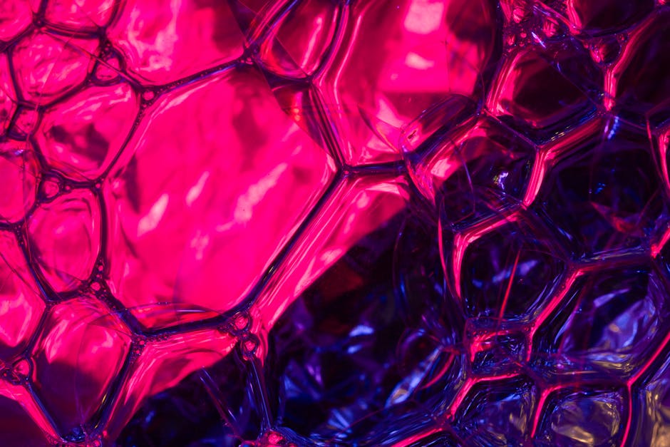 Op Art Kaleidoscope wallpaper pattern — base photo: Captivating abstract image showcasing a close-up of pink and purple bubbles with a neon glow.