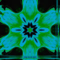 A seamless abstract wallpaper pattern featuring symmetrical blue and white geometric shards in a radial Kaleidoscope arrangement.