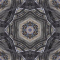 Kaleidoscope pattern of vibrant geometric shapes and colors, reminiscent of light through a cathedral stained glass window.