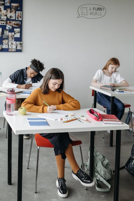 Seamless mirror wallpaper pattern — Biochemistry by wallpaper⁶ — base photo: Teenagers focused on learning in a modern classroom environment.