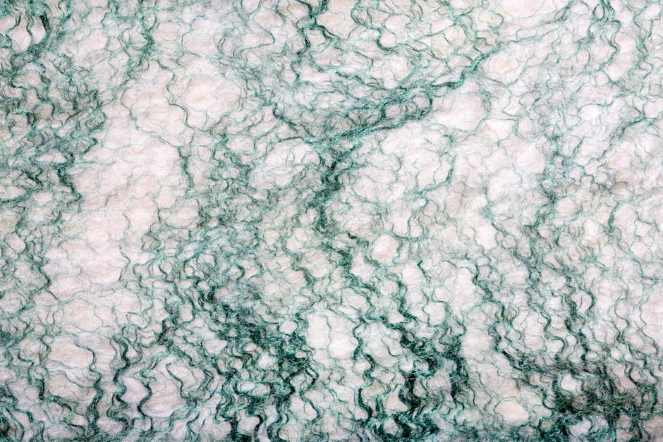 Seamless mirror wallpaper pattern — Origami by wallpaper⁶ — base photo: A detailed abstract image of marble texture featuring intricate green veins on a light background.