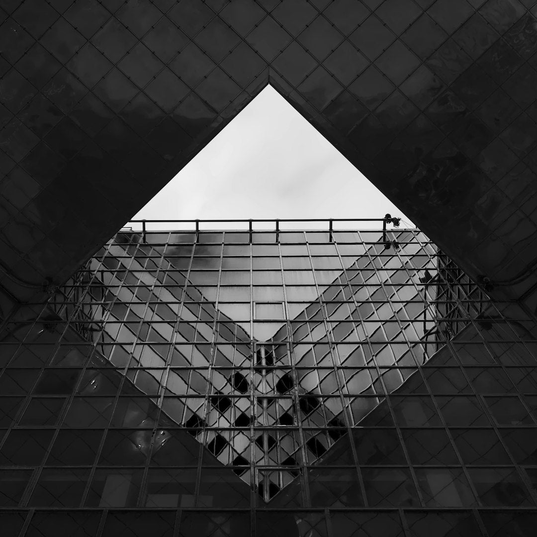 WALLPAPER⁶ — seamless diamond pattern from constructivism art, Bauhaus — base photo: a black and white photo of a building