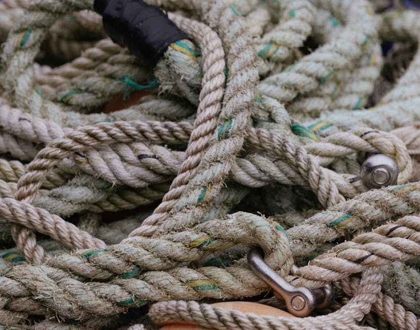 Topology Hexagon wallpaper pattern — base photo: Detailed shot of old, coiled jute ropes intertwined in a nautical environment.