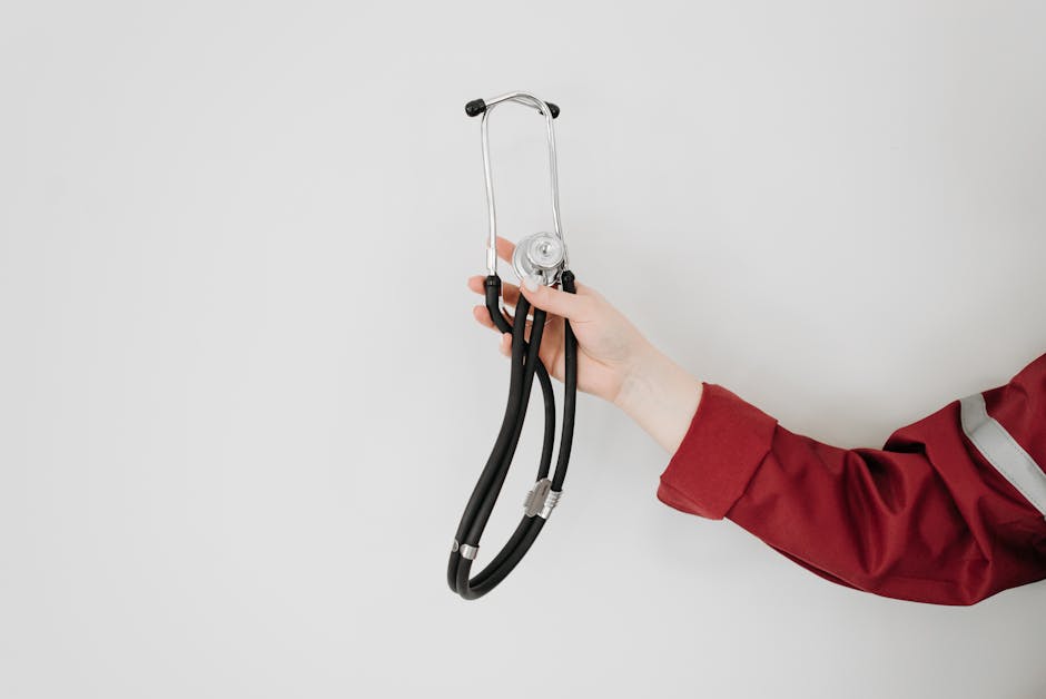 Seamless hex wallpaper pattern — Medicine by wallpaper⁶ — base photo: A healthcare worker holding a stethoscope, symbolizing medical care and expertise.