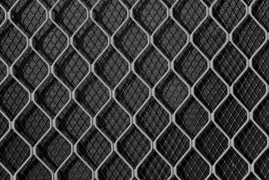 Seamless kaleidoscope wallpaper pattern — Geometry by wallpaper⁶ — base photo: Close-up view of a textured metal mesh grid creating an abstract geometric pattern.