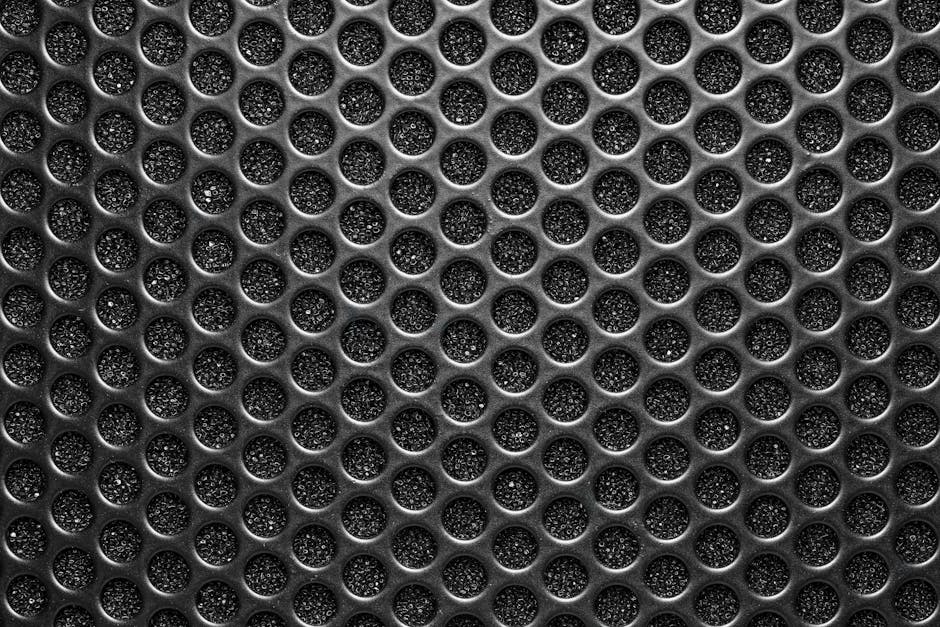 Molecular Physics Mirror wallpaper pattern — base photo: Detailed abstract pattern of a metallic speaker grill showing geometric texture.