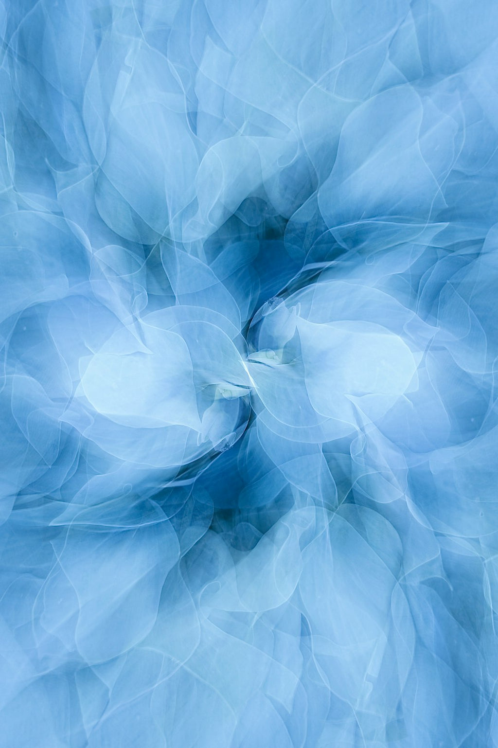 Fractals Pinwheel wallpaper pattern — base photo: a blue background with a circular design in the middle