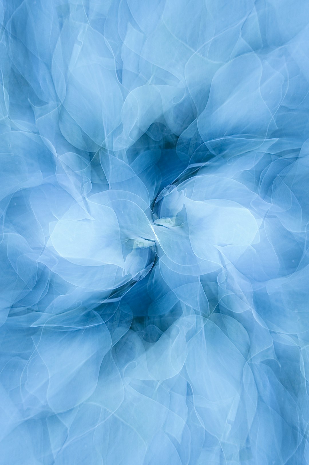 Fractals Pinwheel wallpaper pattern — base photo: a blue background with a circular design in the middle