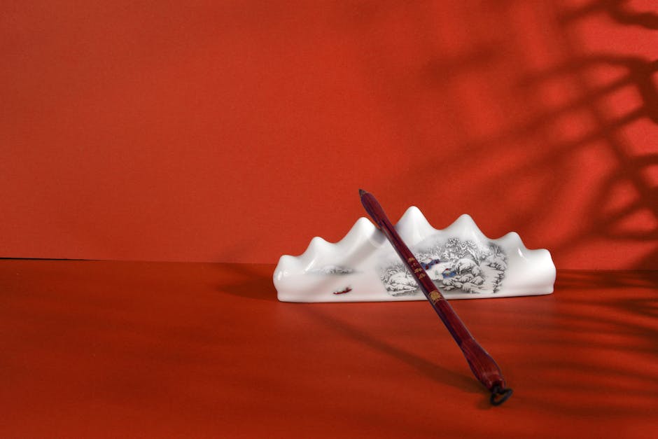 Seamless hex wallpaper pattern — Calligraphy by wallpaper⁶ — base photo: Elegant still life of an Asian ink brush with a ceramic holder against a red background.