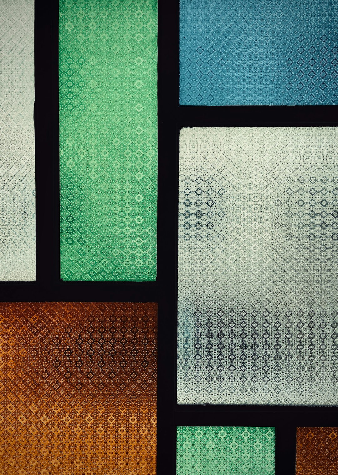 Close-up of Geometric Jewel Tones stained glass wallpaper in Hex symmetry mode, showing vibrant colors and precise geometric shapes. — base photo: A vibrant close-up view of a glass surface, showcasing a mosaic of richly colored geometric shapes a