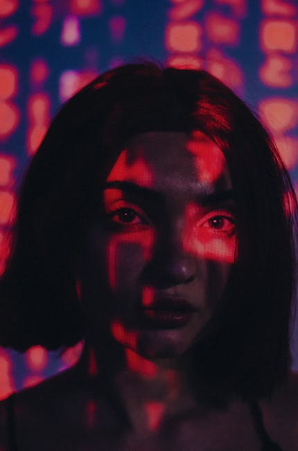 Seamless diamond wallpaper pattern — Glitch by wallpaper⁶ — base photo: Moody portrait of a woman with red and blue light projections on her face, creating an artistic and 