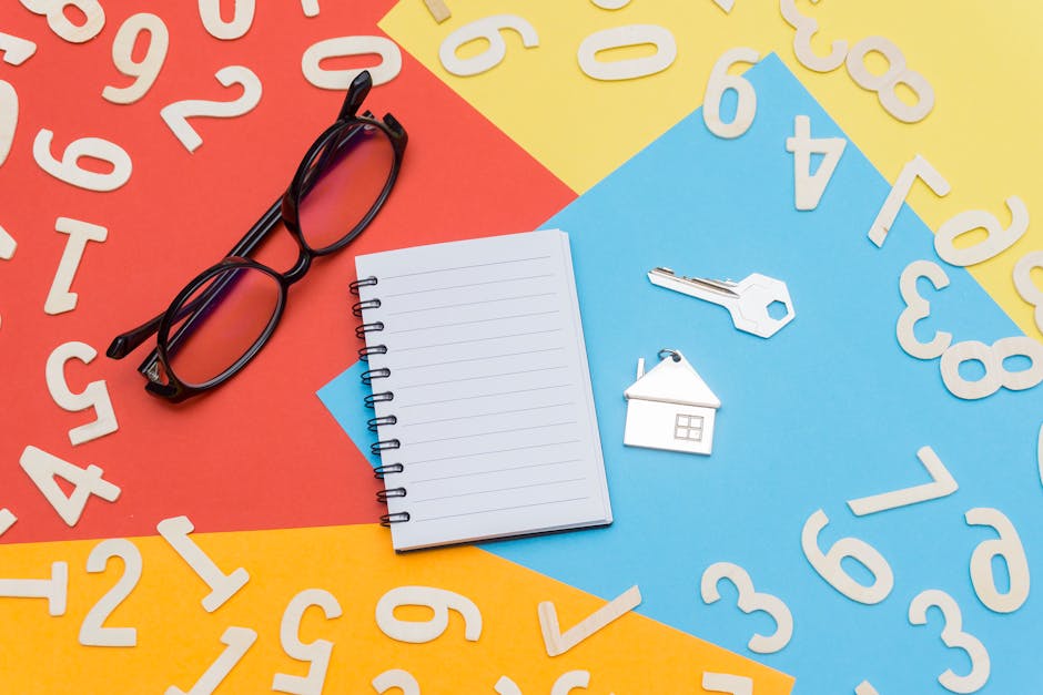 Seamless kaleidoscope wallpaper pattern — Arithmetic by wallpaper⁶ — base photo: Flat lay of a colorful desktop featuring a notebook, eyeglasses, and house key with numbers scattere