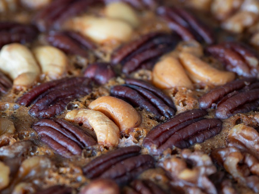Fractals Kaleidoscope wallpaper pattern — base photo: Delicious homemade fruit cake topped with a rich assortment of nuts, perfect for festive occasions.