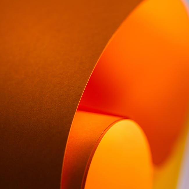 Seamless diamond wallpaper pattern — Origami by wallpaper⁶ — base photo: Abstract image of curved orange paper with a soft gradient and elegant flow. Perfect for backgrounds