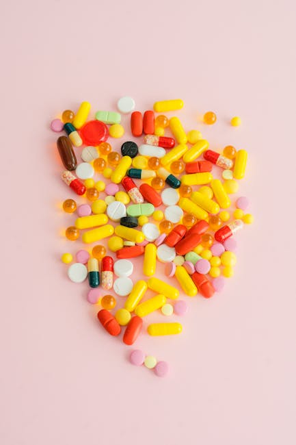 Seamless hex wallpaper pattern — Biochemistry by wallpaper⁶ — base photo: A vibrant collection of assorted medications and supplements on a pink surface.