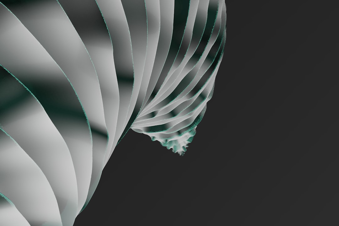 Möbius Twist Hex wallpaper pattern with a topology theme, based on a black and white photo of a curved object resembling a Möbius strip. — base photo: A striking black and white photograph of a curved object, artfully capturing the essence of a Möbius