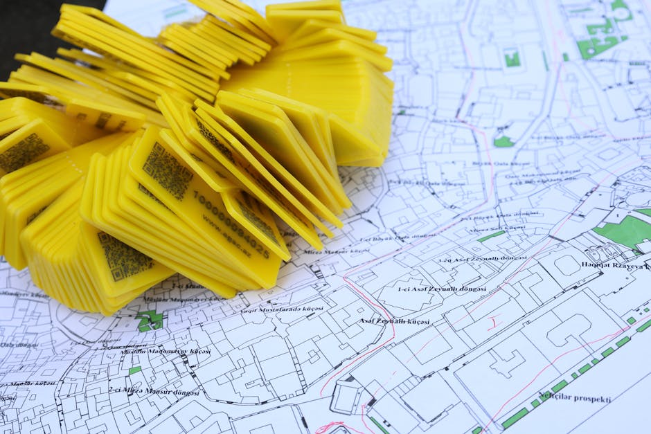 Seamless brick wallpaper pattern — Cartography by wallpaper⁶ — base photo: Stack of yellow QR code markers placed on a detailed map for location tracking and navigation.