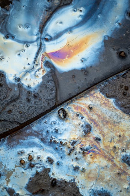 Chemistry Hexagon wallpaper pattern — base photo: Vivid oil spill creating iridescent patterns on a wet street surface.
