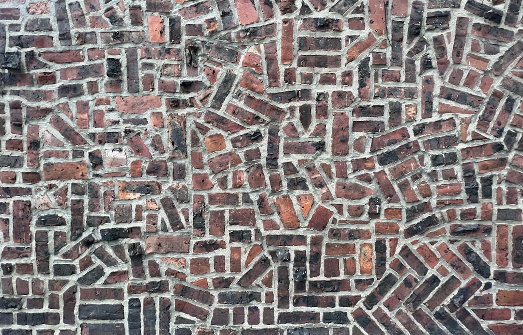 Seamless kaleidoscope wallpaper pattern — Arithmetic by wallpaper⁶ — base photo: a close up of a wall made of bricks