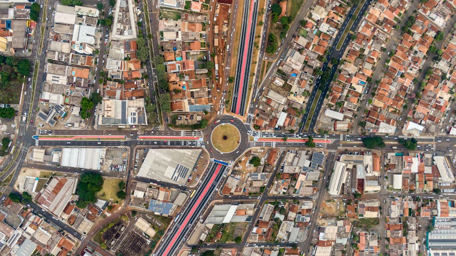 Seamless brick wallpaper pattern — Cartography by wallpaper⁶ — base photo: Aerial view of a vibrant urban roundabout in Londrina, Brazil, showcasing a bustling residential dis