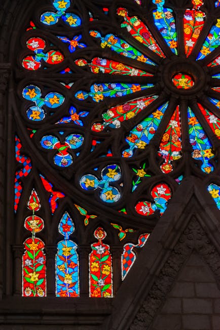 A mesmerizing kaleidoscope pattern derived from colorful neo-gothic stained glass, featuring intricate geometric shapes and rich jewel tones. — base photo: A close-up capture of a colorful neo-gothic stained glass window, featuring intricate lead lines and