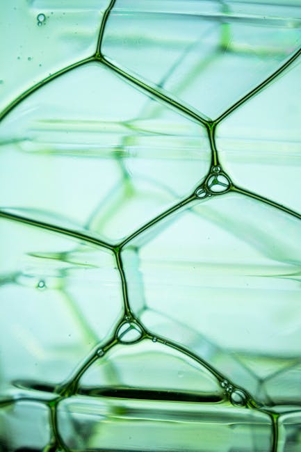 Seamless diamond wallpaper pattern — Stained Glass by wallpaper⁶ — base photo: Intricate green liquid bubbles create a mesmerizing abstract pattern.
