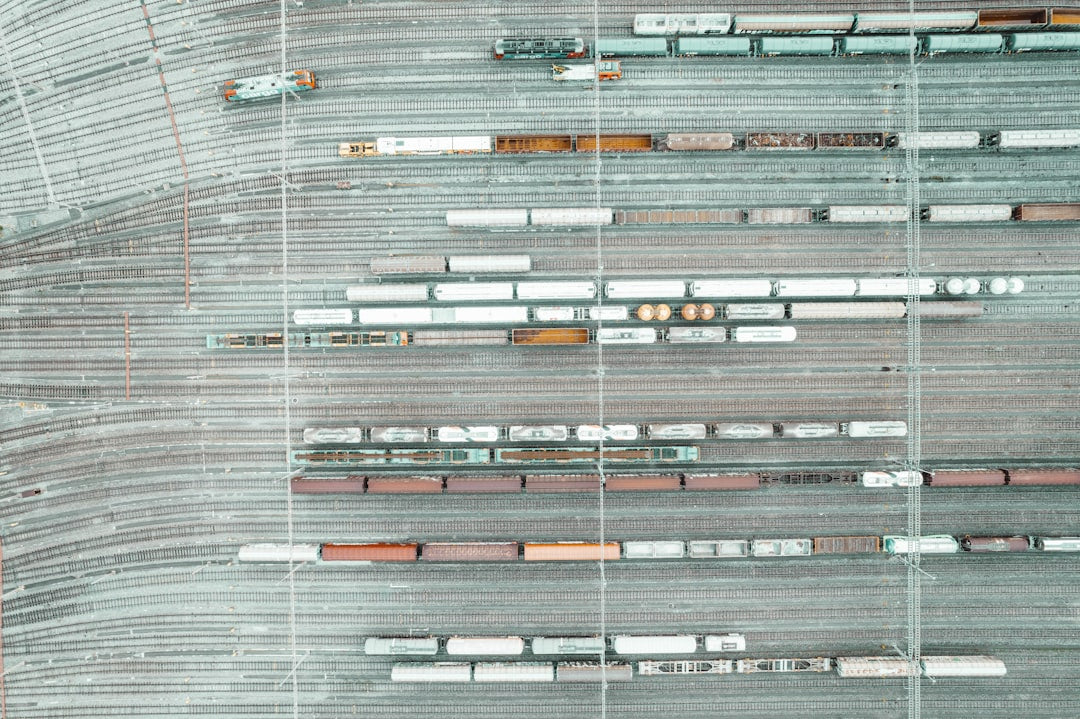 Seamless brick wallpaper pattern — Cartography by wallpaper⁶ — base photo: An aerial view of a train yard and tracks