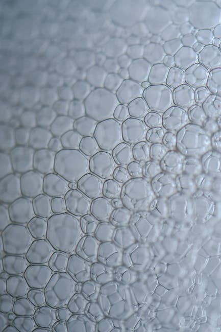Seamless kaleidoscope wallpaper pattern — Geometry by wallpaper⁶ — base photo: Intricate translucent bubble patterns creating an abstract texture in soft lighting. Ideal for backg