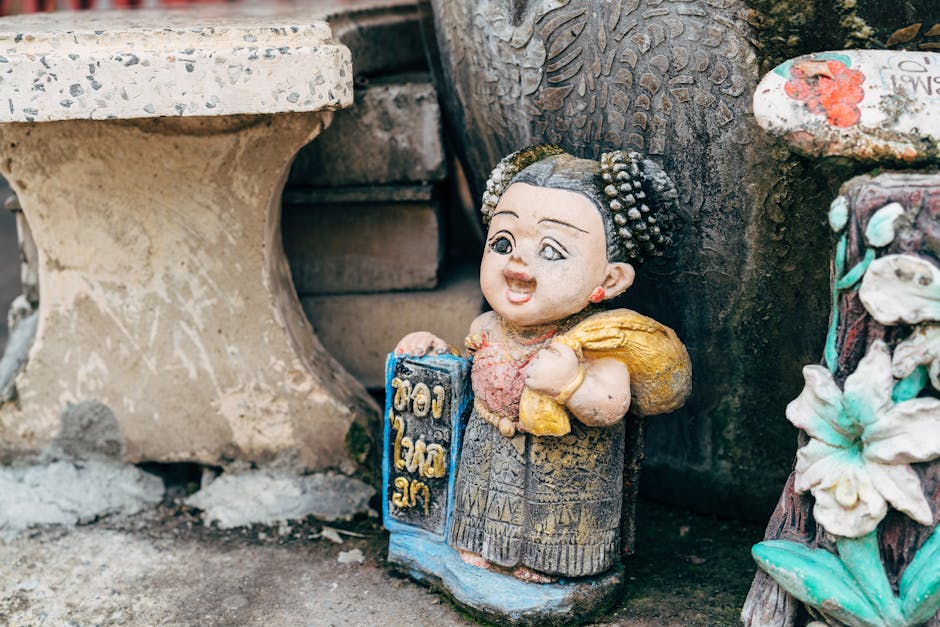 Seamless mirror wallpaper pattern — Calligraphy by wallpaper⁶ — base photo: Close-up of a vibrant traditional figurine on a concrete surface, showcasing cultural artistry.