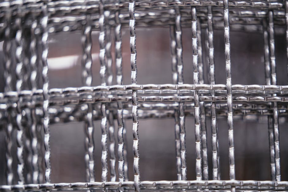 Molecular Physics Mirror wallpaper pattern — base photo: Detailed view of intertwined steel wires forming a sturdy mesh structure. Ideal for construction the