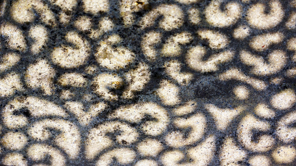Borromean Rings pattern with pinwheel symmetry, inspired by topology and chocolate texture. — base photo: A close-up view of a beautifully arranged pile of rich, dark chocolate. Its textured surface suggest