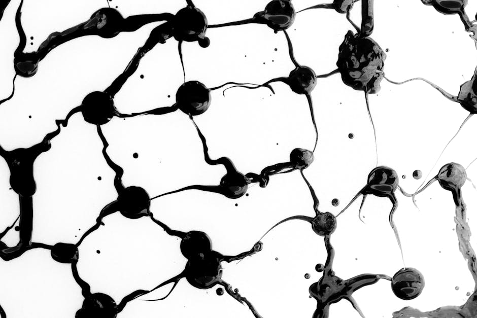 Cosmology Pinwheel wallpaper pattern — base photo: Intricate black ink patterns create a striking abstract design on a white backdrop.