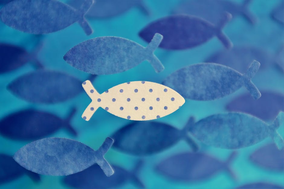 Seamless diamond wallpaper pattern — Origami by wallpaper⁶ — base photo: Artistic fish pattern showcasing uniqueness with one polka dot fish in a blue sea theme.