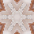 A radial kaleidoscope pattern of black and grey mineral shards forming a complex geometric starburst symmetry.