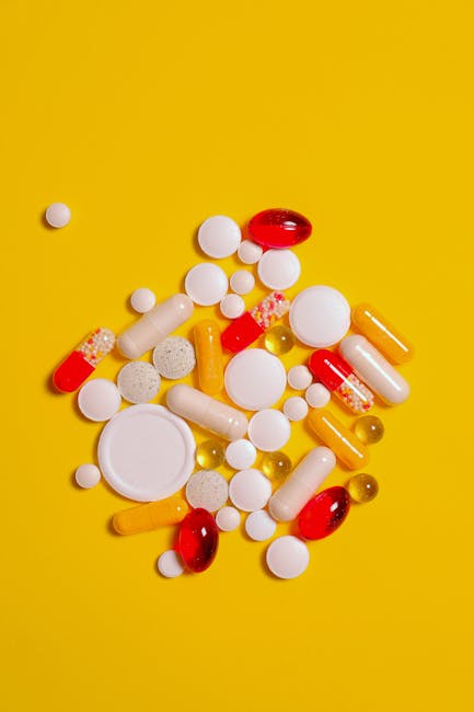 Seamless mirror wallpaper pattern — Medicine by wallpaper⁶ — base photo: A collection of diverse tablets and capsules on a vibrant yellow background, symbolizing healthcare 