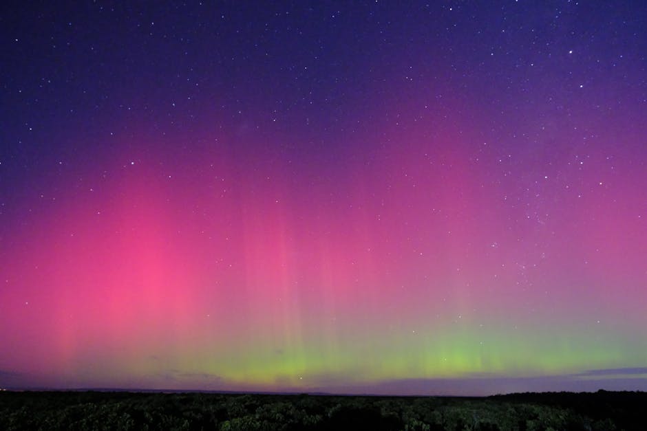 Seamless mirror wallpaper pattern — Astronomy by wallpaper⁶ — base photo: Stunning aurora borealis lights up the night sky, captured in Blind Bight, Australia.