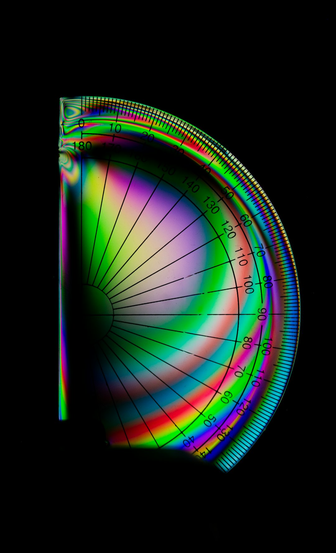 Seamless kaleidoscope wallpaper pattern — Cosmology by wallpaper⁶ — base photo: A protractor with iridescent colors on a black background.
