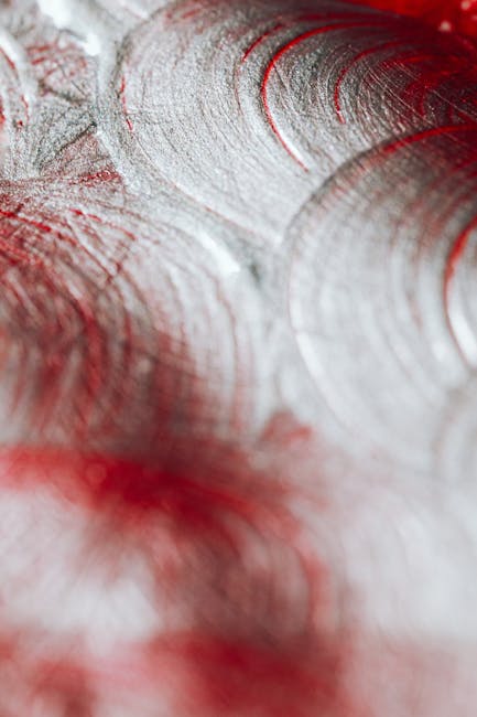Seamless mirror wallpaper pattern — Calligraphy by wallpaper⁶ — base photo: Close-up abstract photo of metallic spiral texture with red accents, artistic and vibrant.