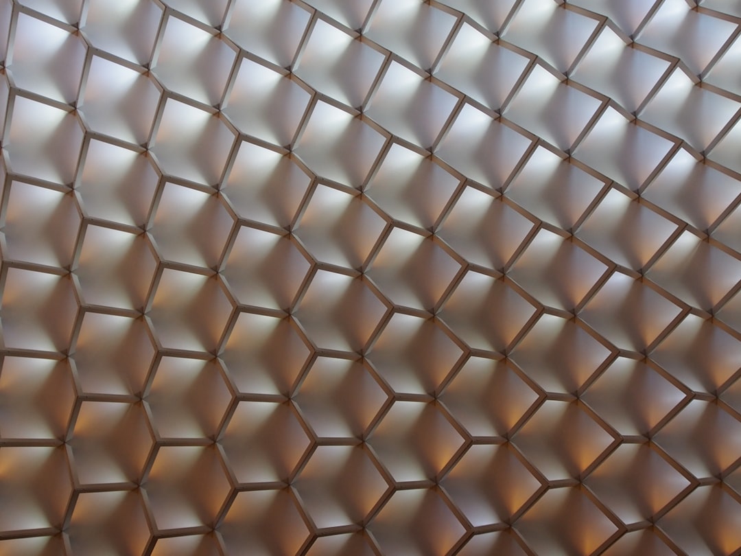Seamless kaleidoscope wallpaper pattern — Stained Glass by wallpaper⁶ — base photo: a close up view of a metal mesh fence