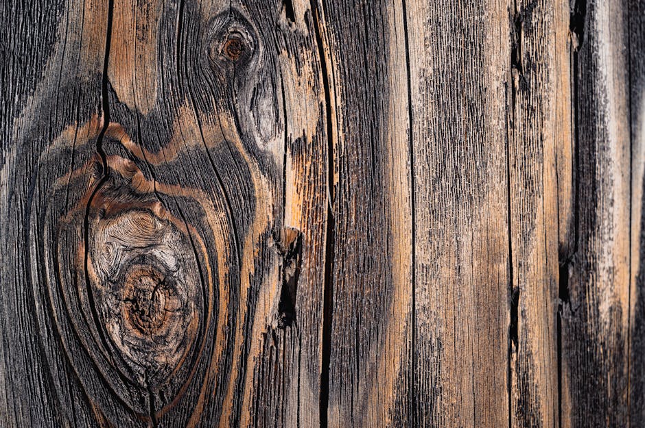 Topology Kaleidoscope wallpaper pattern — base photo: Detailed close-up of a weathered wooden surface with distinct grain patterns and natural knots.