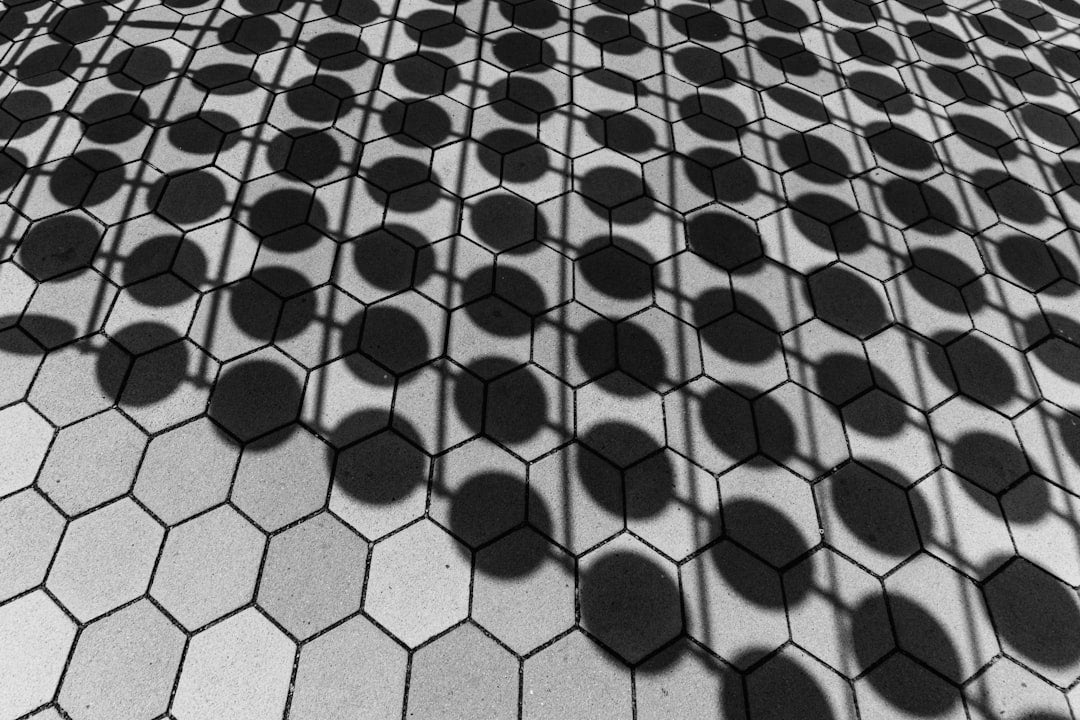 Molecular Physics Kaleidoscope wallpaper pattern — base photo: Hexagons and circles cast patterned shadows.