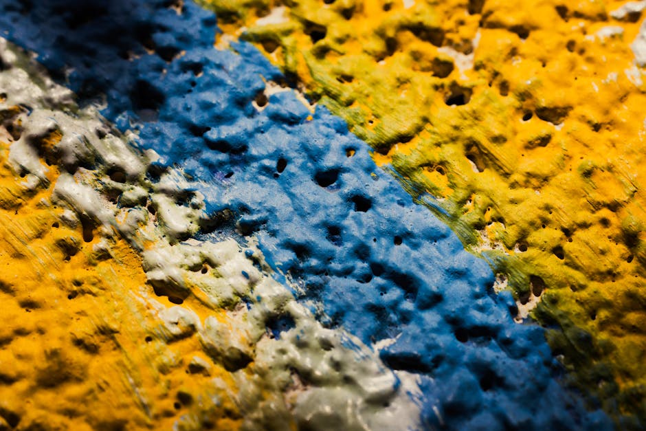 Seamless mirror wallpaper pattern — Algebra by wallpaper⁶ — base photo: Close-up shot of a brightly painted textured surface featuring blue, yellow, and green hues.