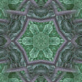 Green stained glass with a diamond pattern, arranged in a kaleidoscope, creating an abstract and artistic symmetrical repeat.