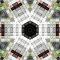 An intricate kaleidoscope pattern of colorful stained glass in hexagonal symmetry with blue, green, and orange jewels.
