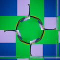 A seamless rotation pattern of ivory fluid lines swirling in a four-way symmetry against a dark background.