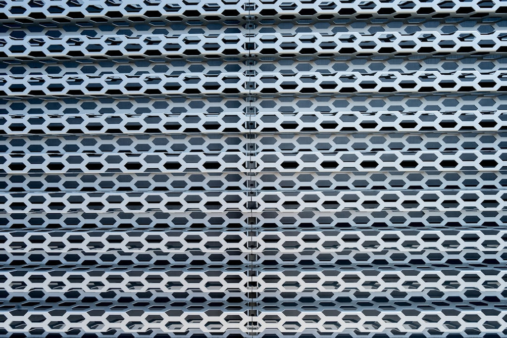 Seamless kaleidoscope wallpaper pattern — Medicine by wallpaper⁶ — base photo: a close up of a metal structure with holes